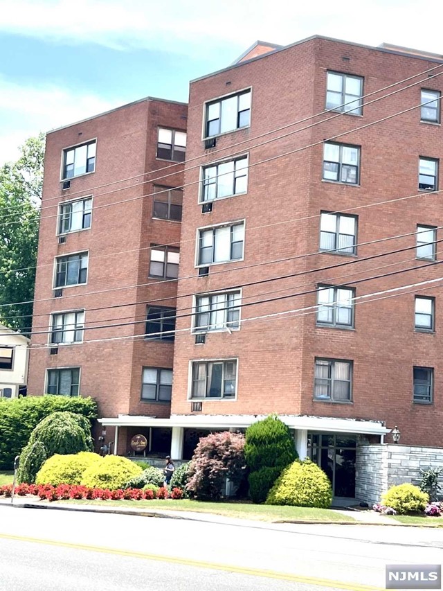 a front view of a multi story residential apartment building