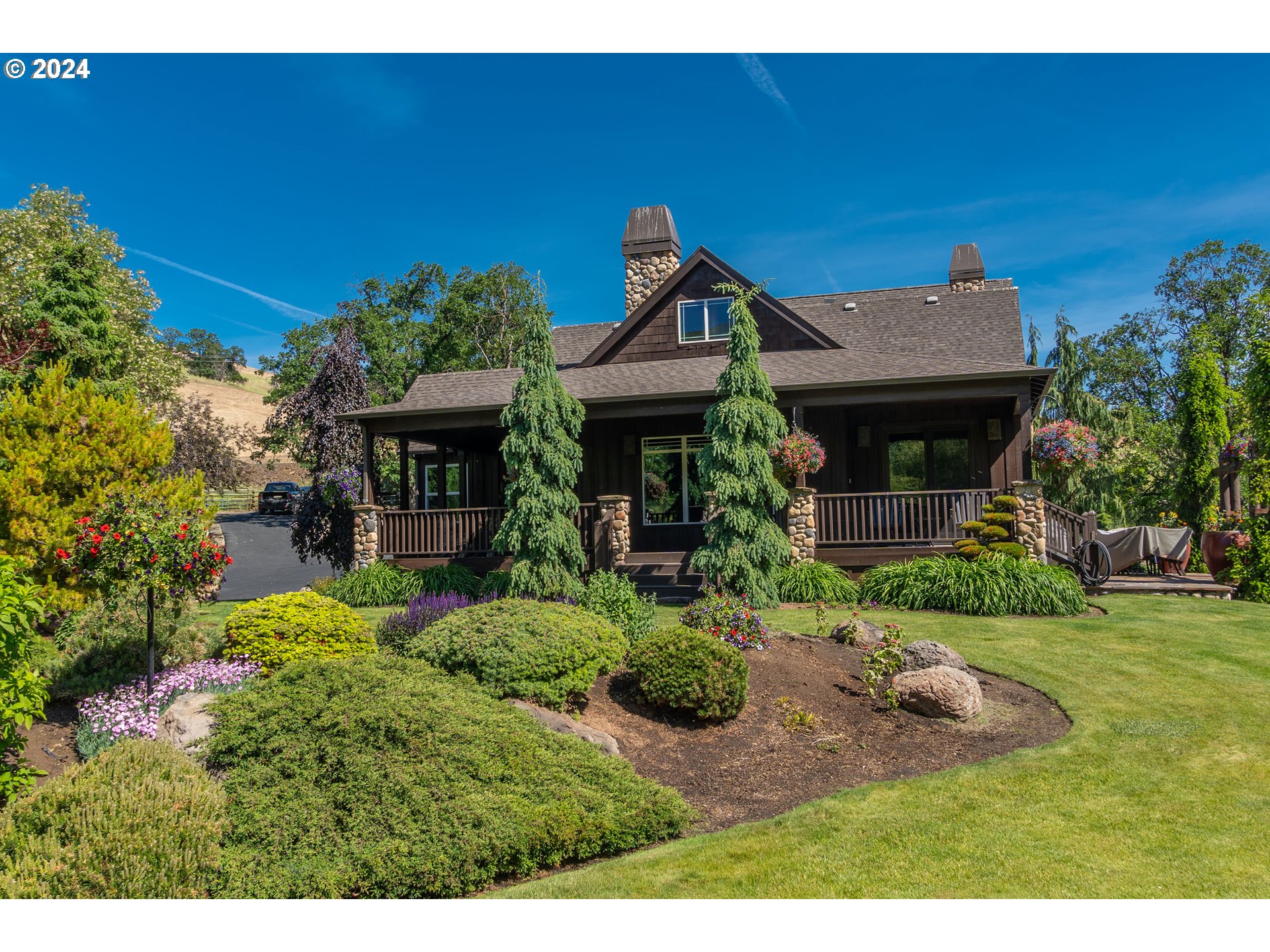 a front view of a house with garden