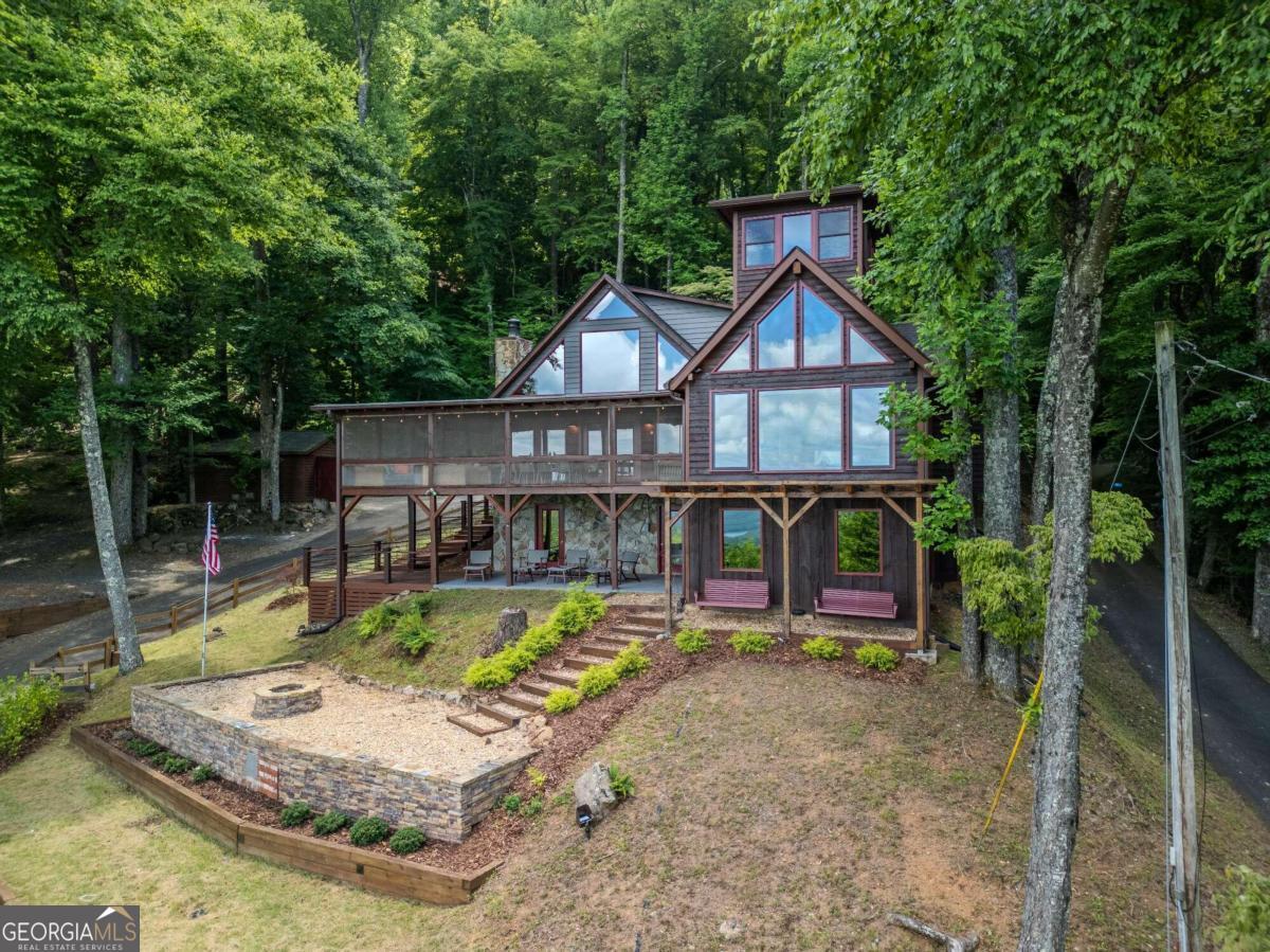 front view of a house with swimming pool and porch