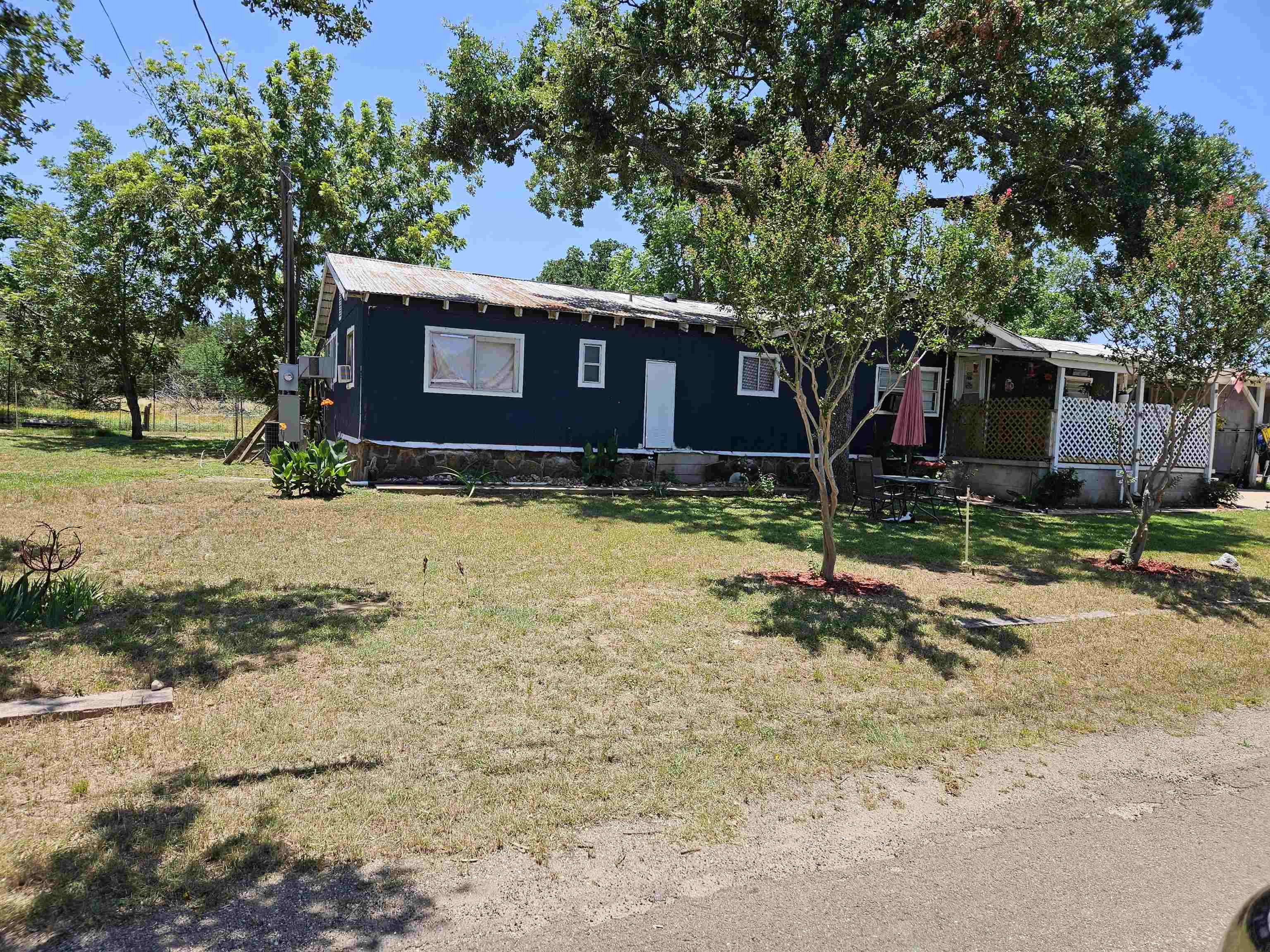 a view of a backyard of the house