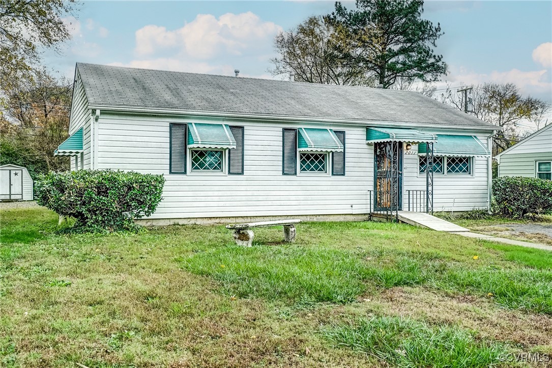 View of front of property with a front lawn