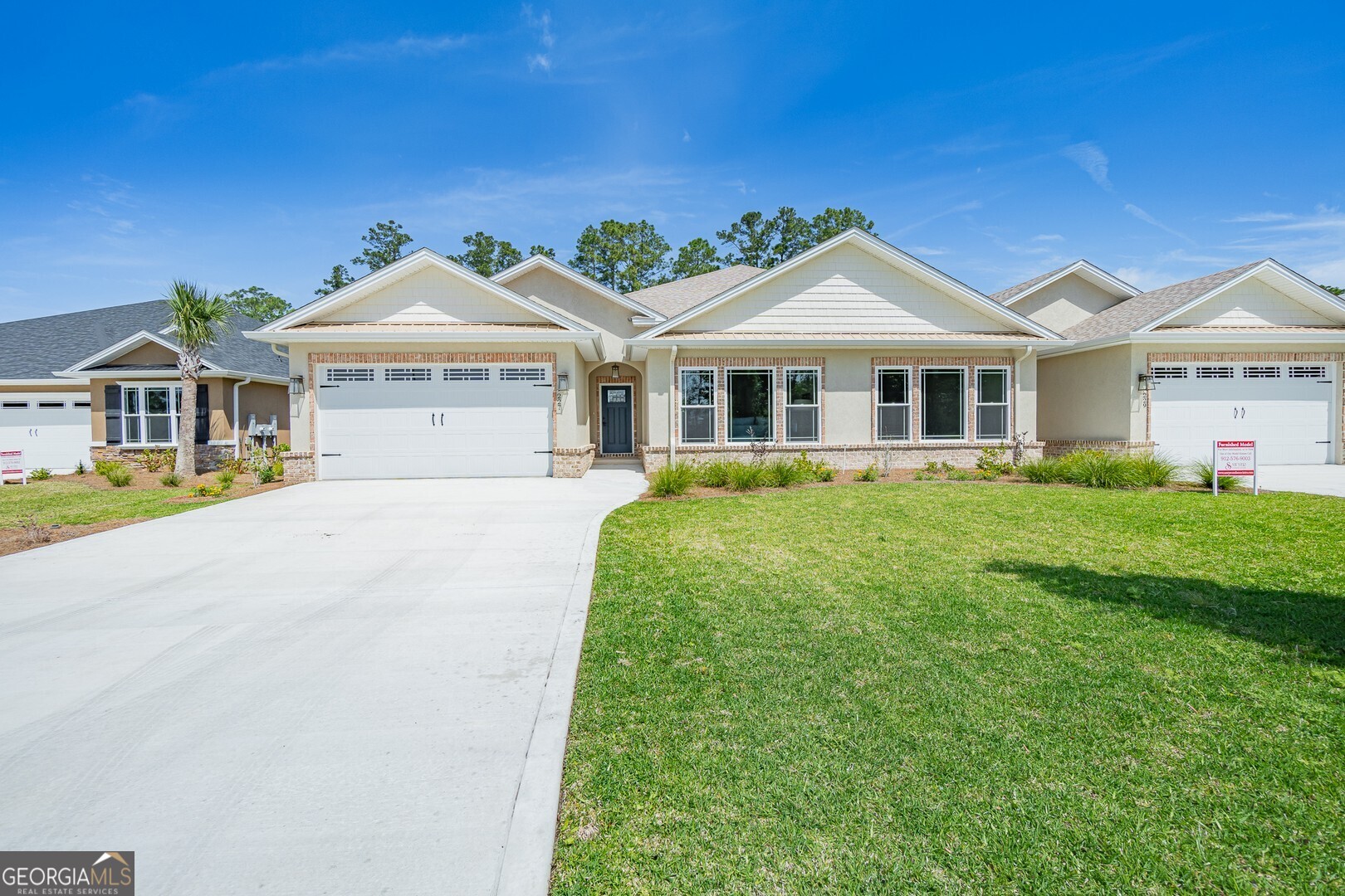 a front view of a house with a yard