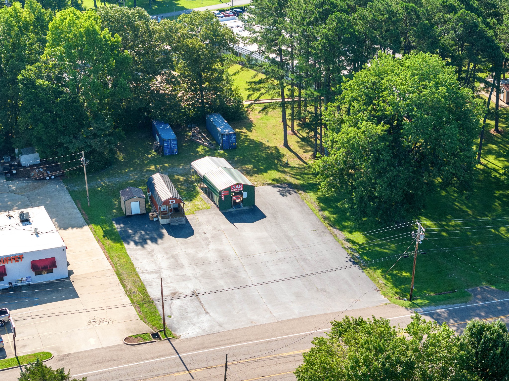 a view of yard from deck with patio