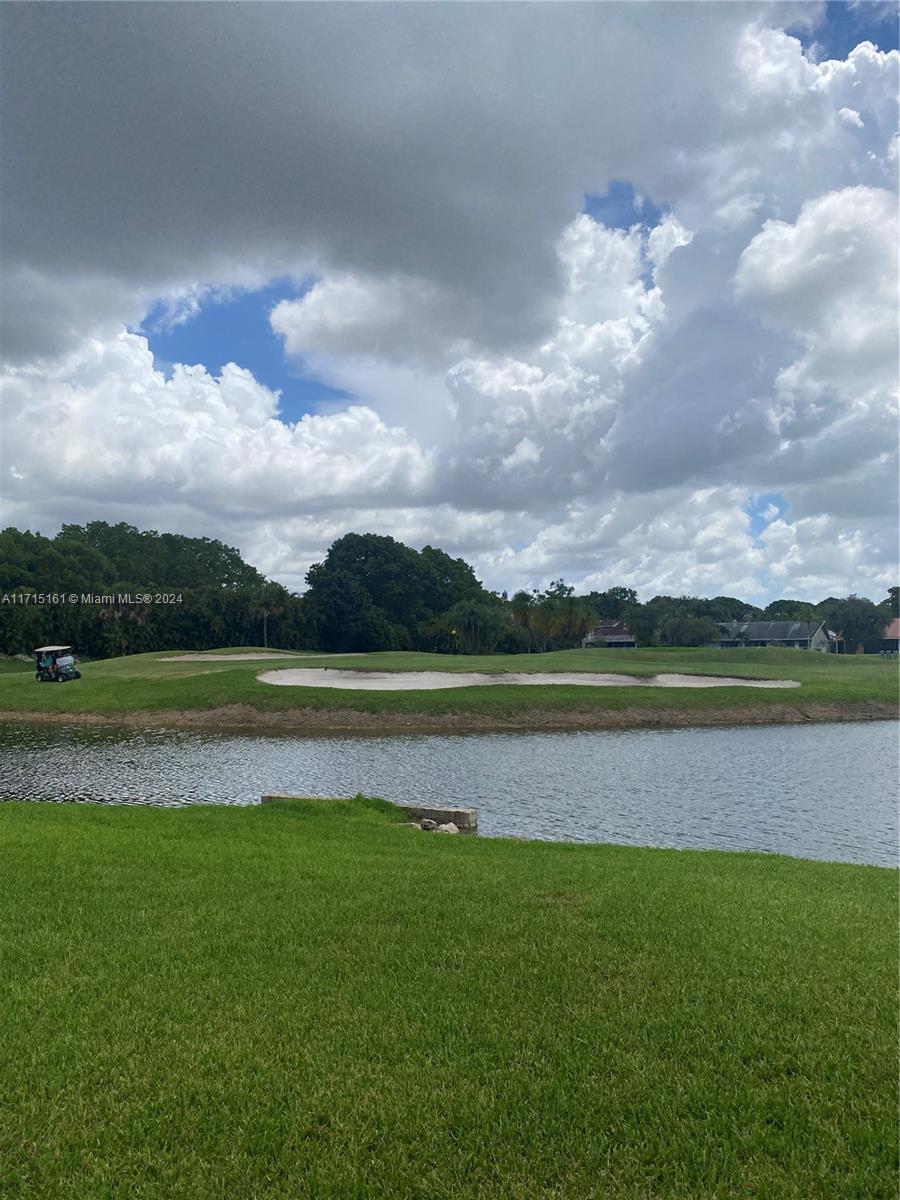 a view of a lake with a big yard