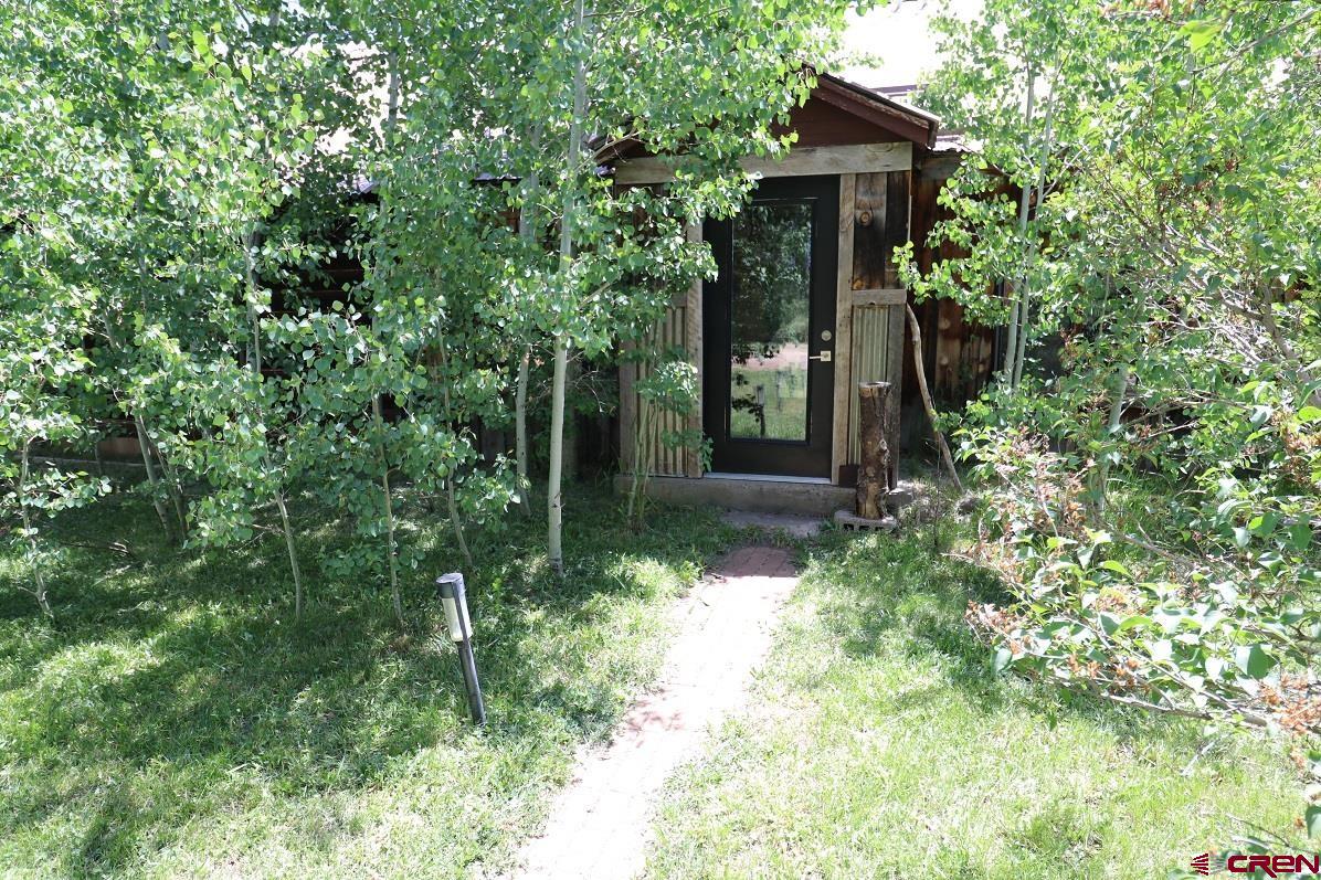 a backyard of a house with lots of green space