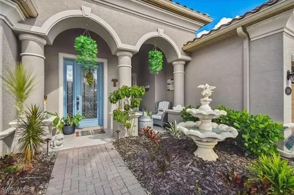 a front view of a house with garden