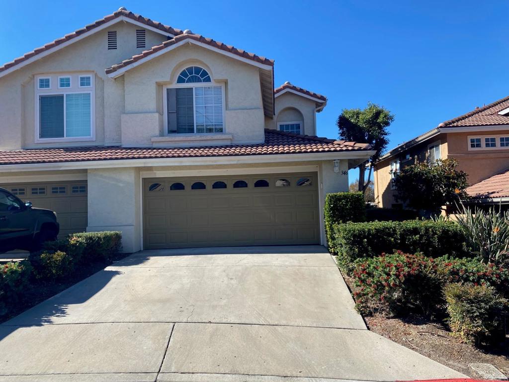 a view of a house with a garage