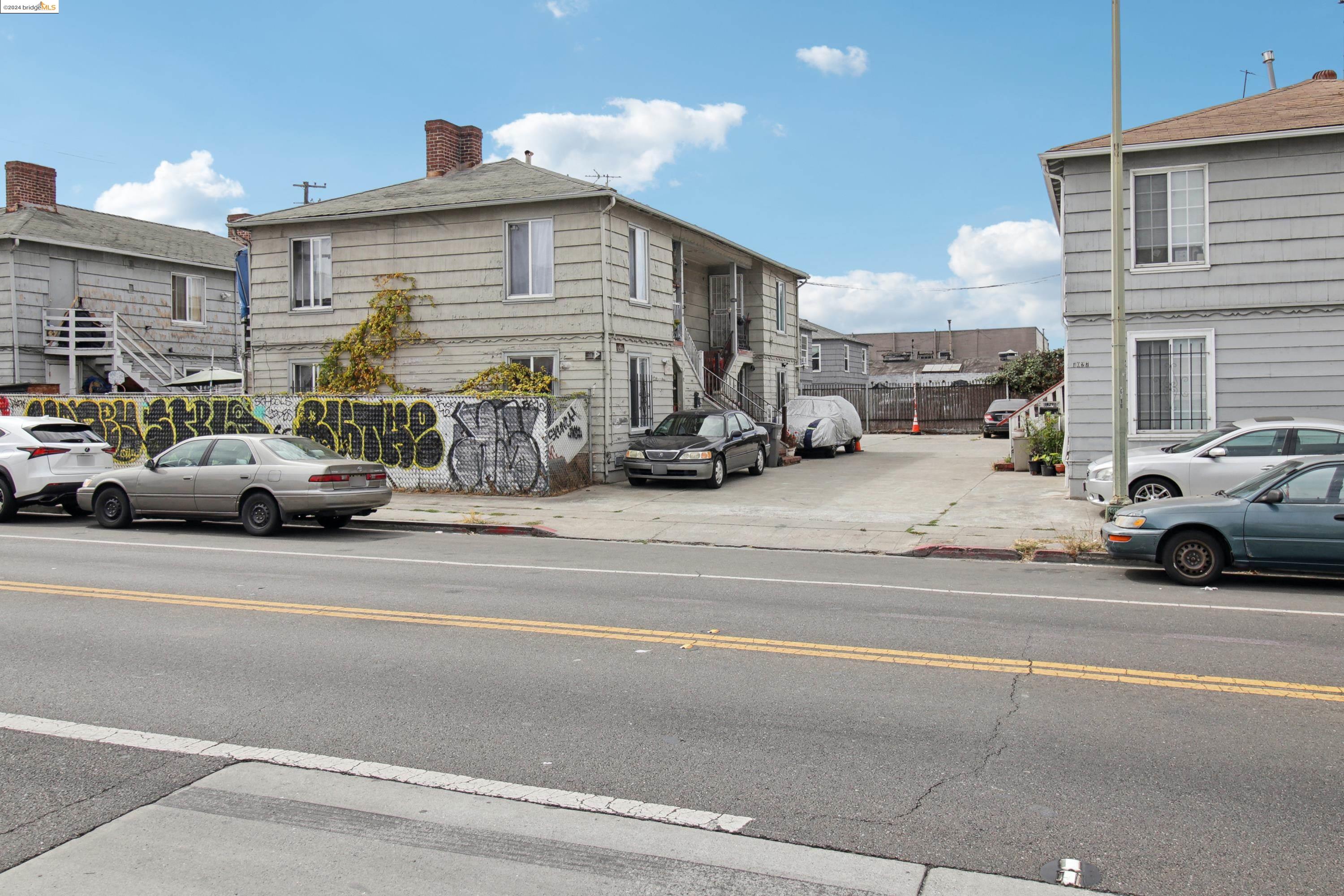 a view of a cars park in front of a building