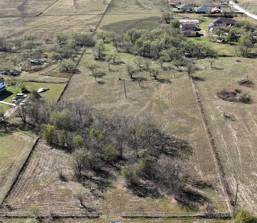 a aerial view of a house with a yard