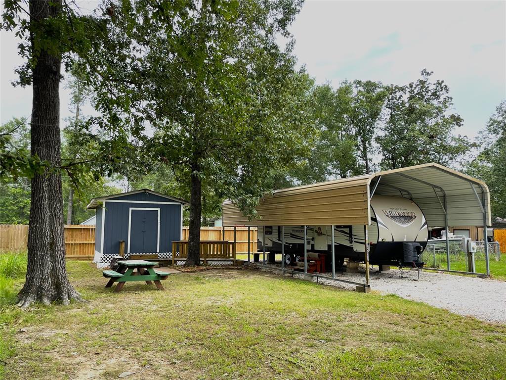 a view of a house with swimming pool and sitting area