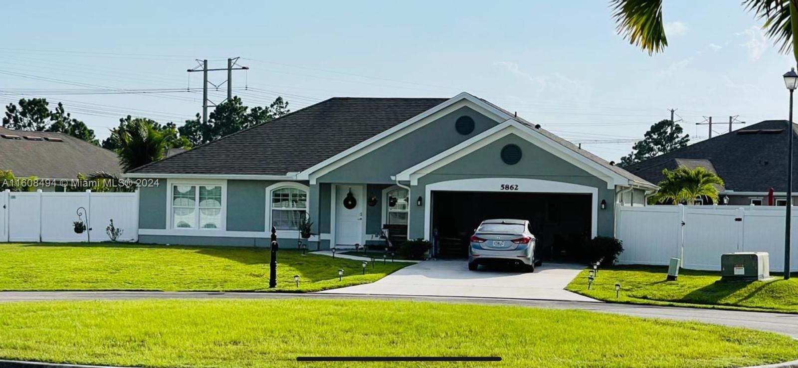 a front view of a house with swimming pool