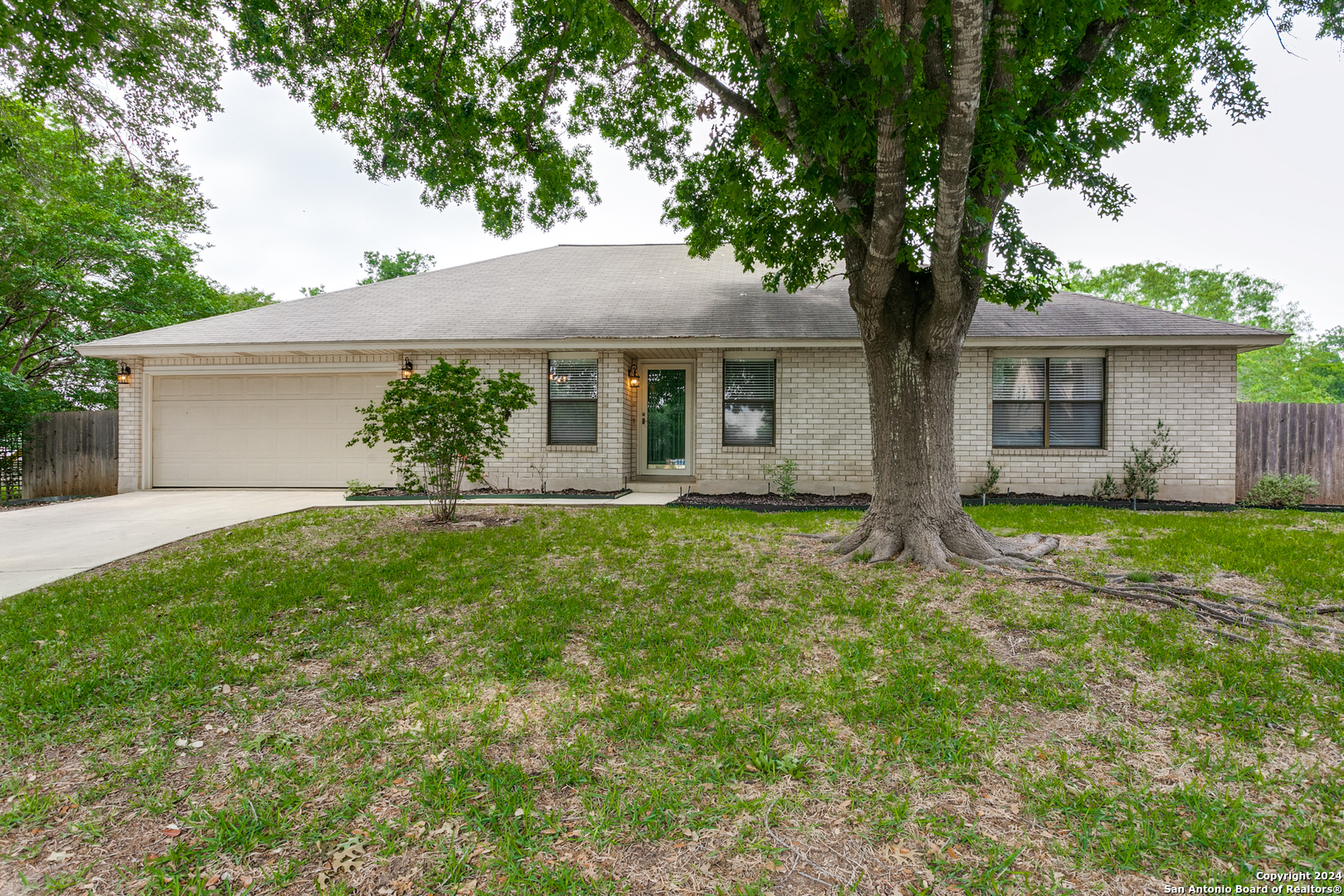 a front view of house with yard and green space