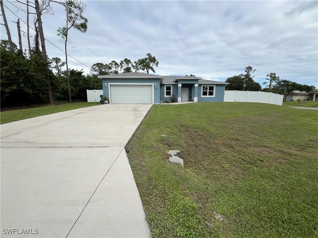 a aerial view of a house with a yard