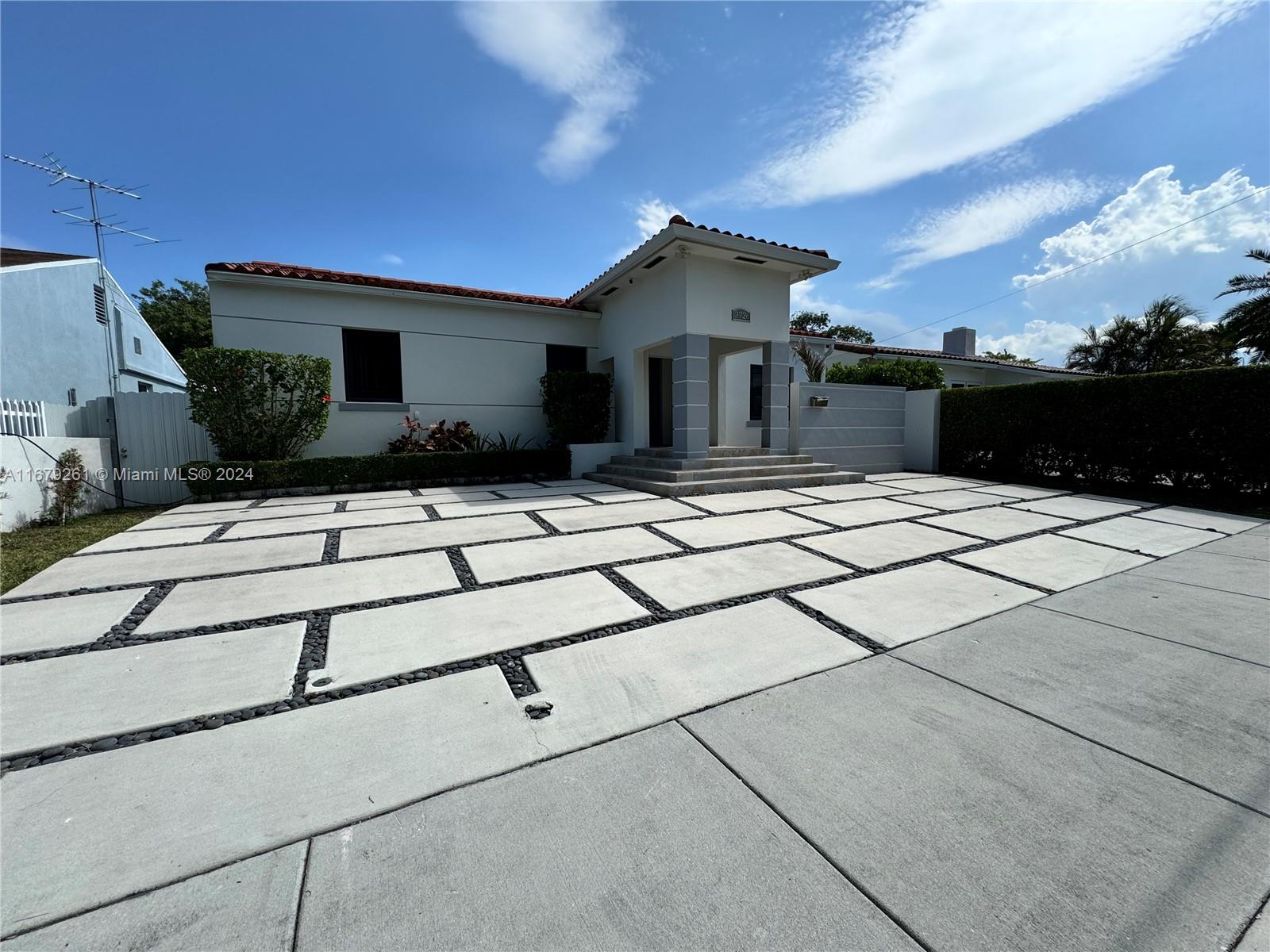 a view of house with yard