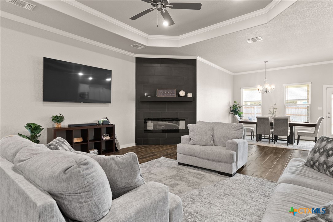 a living room with furniture and a flat screen tv