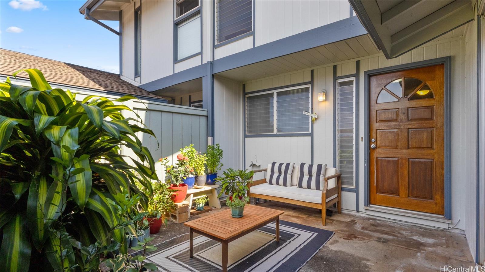 a view of a bench in back of house