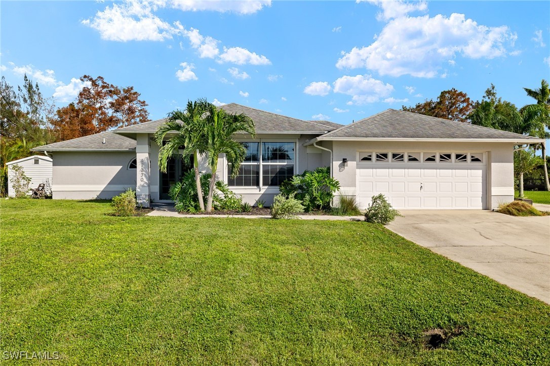 a view of a house with a backyard