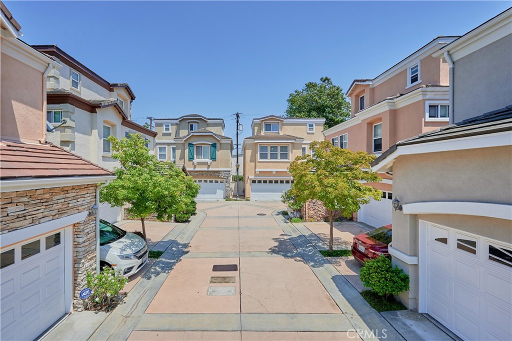 a view of a front of house with a street