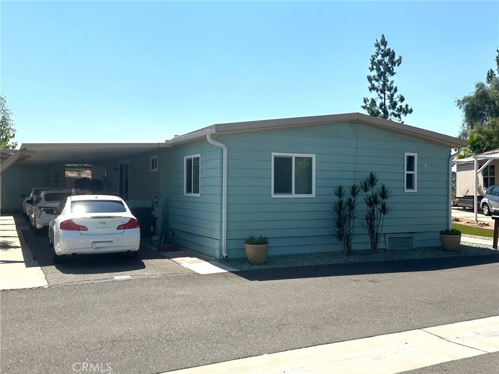 a front view of a house with parking