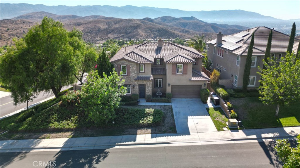 an aerial view of a house with a garden