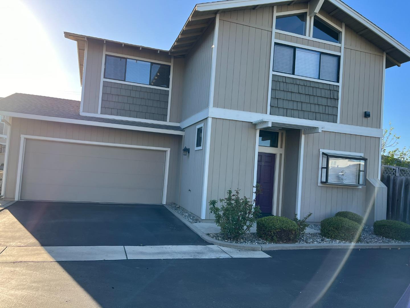 a front view of house along with road