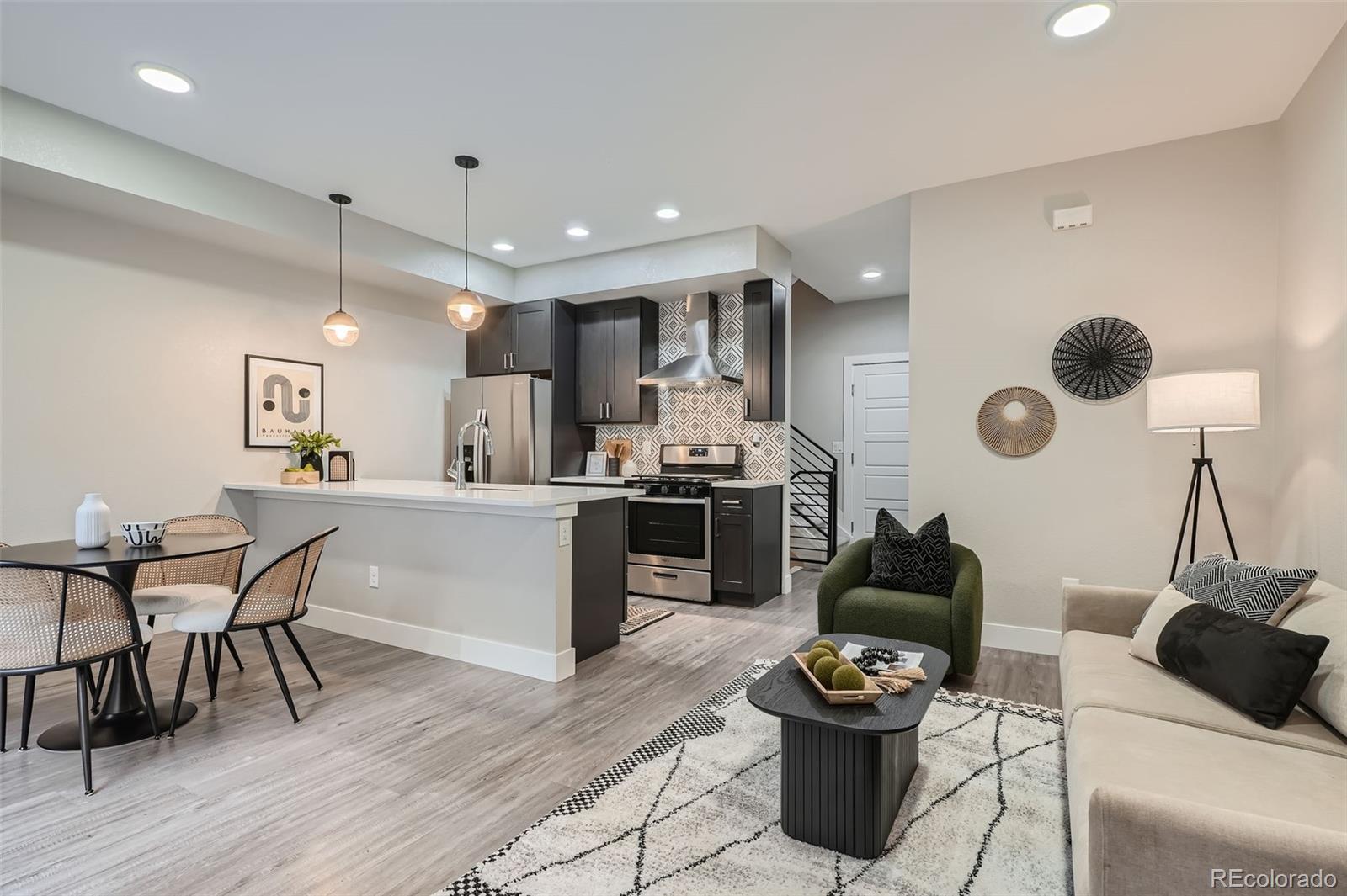 a kitchen with a table and chairs in it