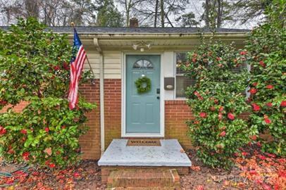 a front view of a house with garden