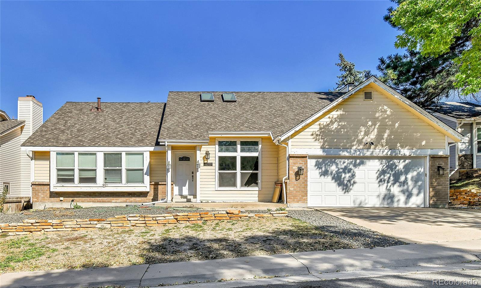 front view of a house with a yard