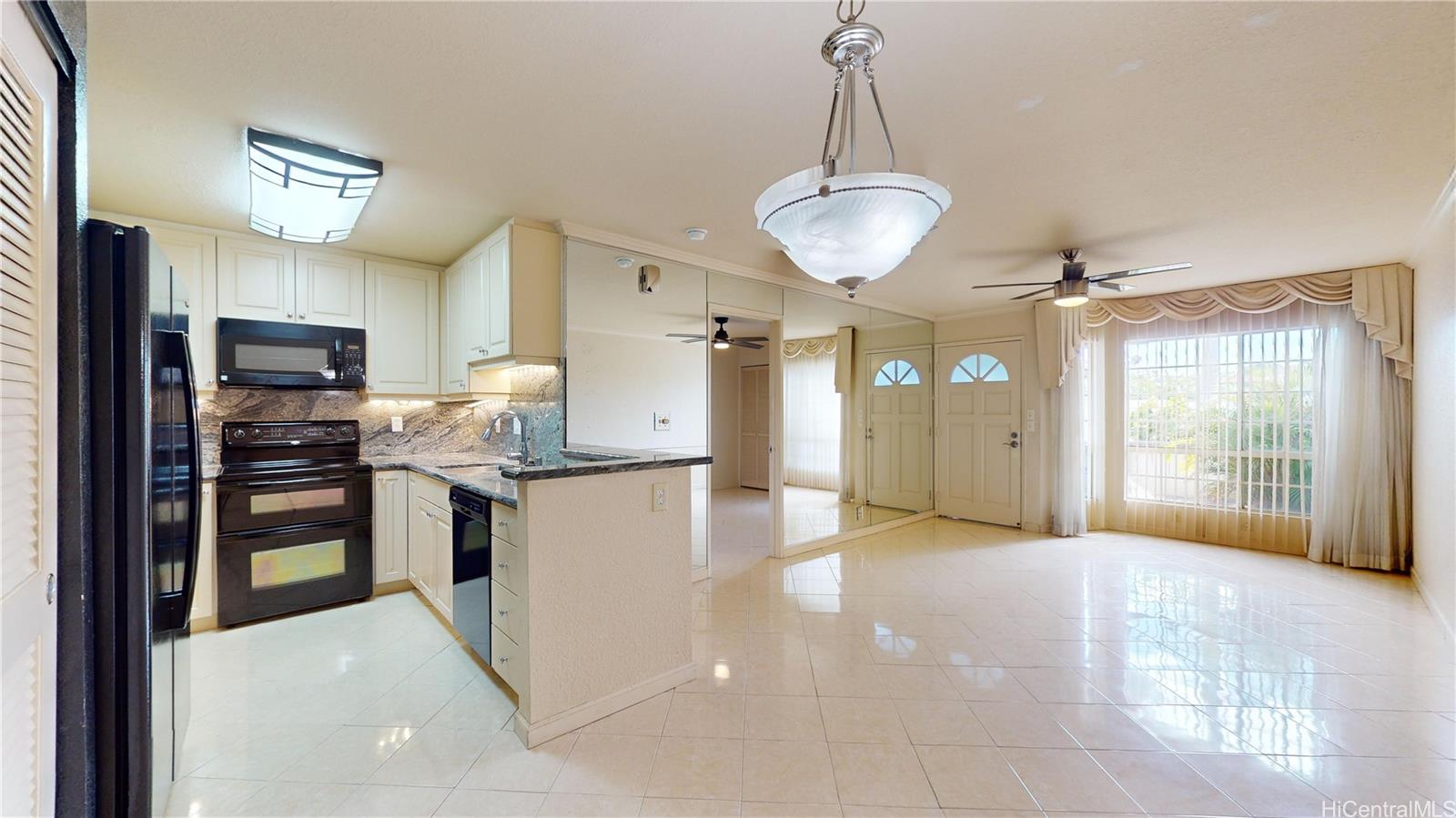 a view of a kitchen with refrigerator and microwave