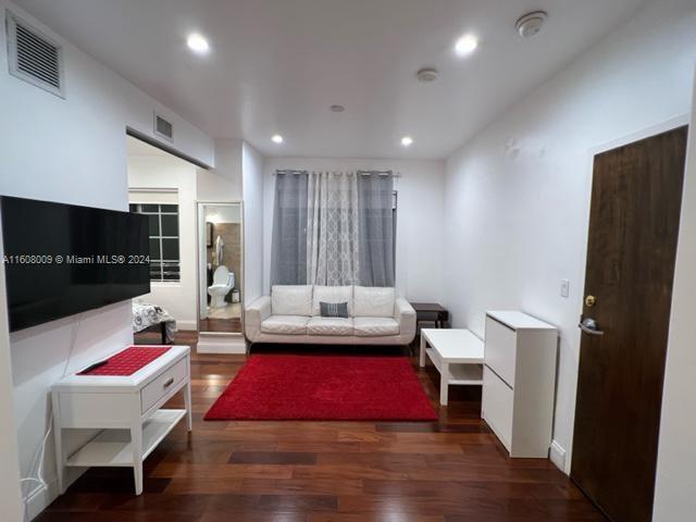 a living room with a couch and a flat screen tv