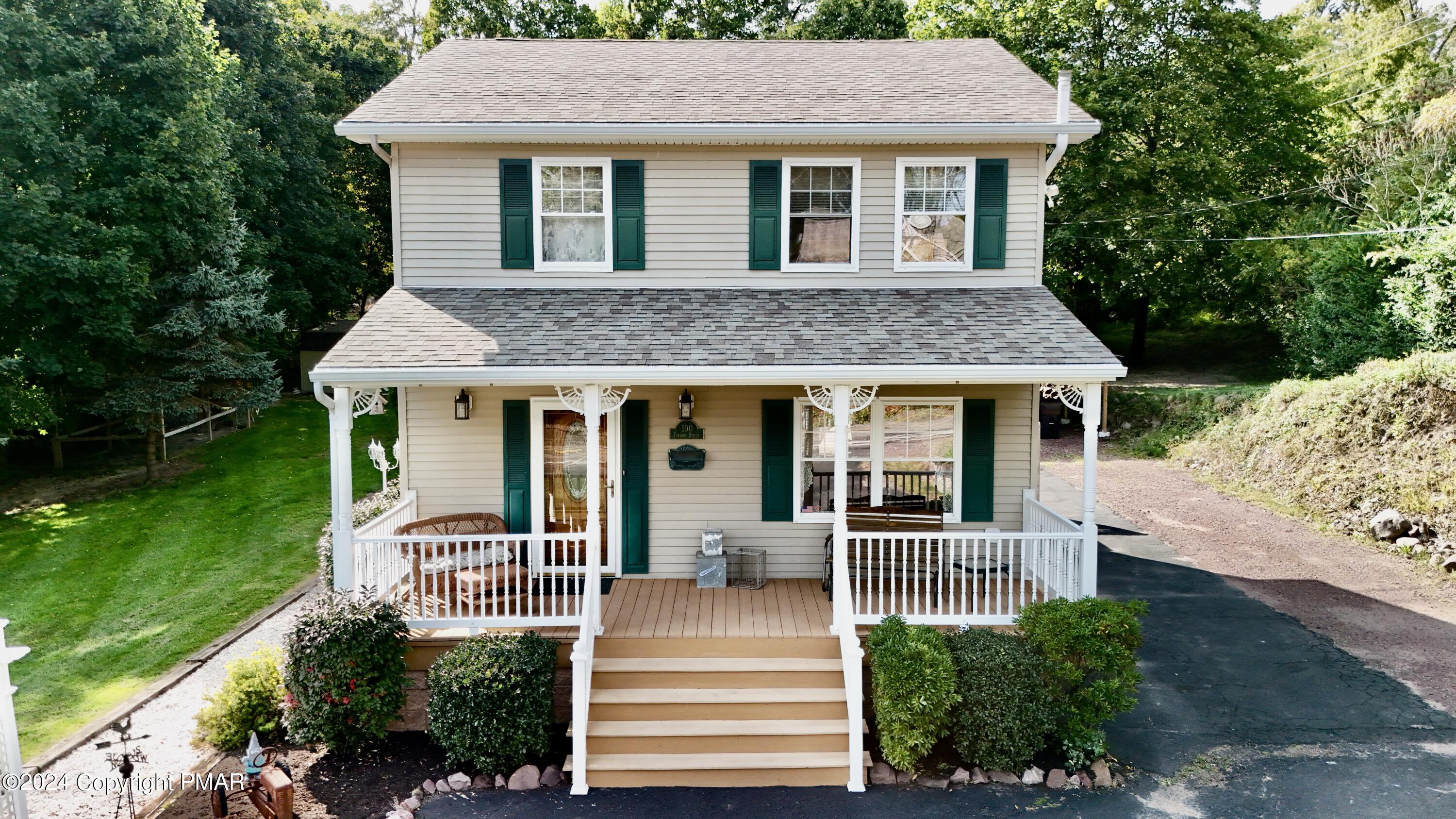 a front view of a house with a porch