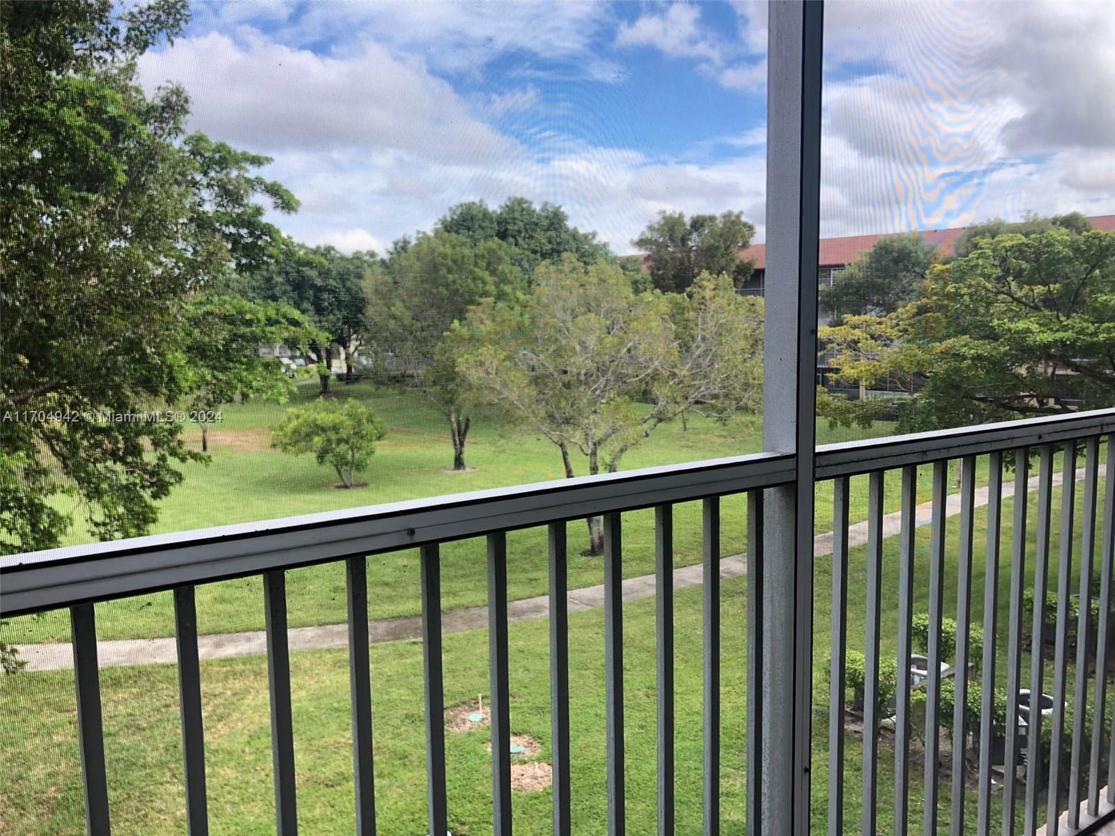 a view of a balcony with lake view and mountain view