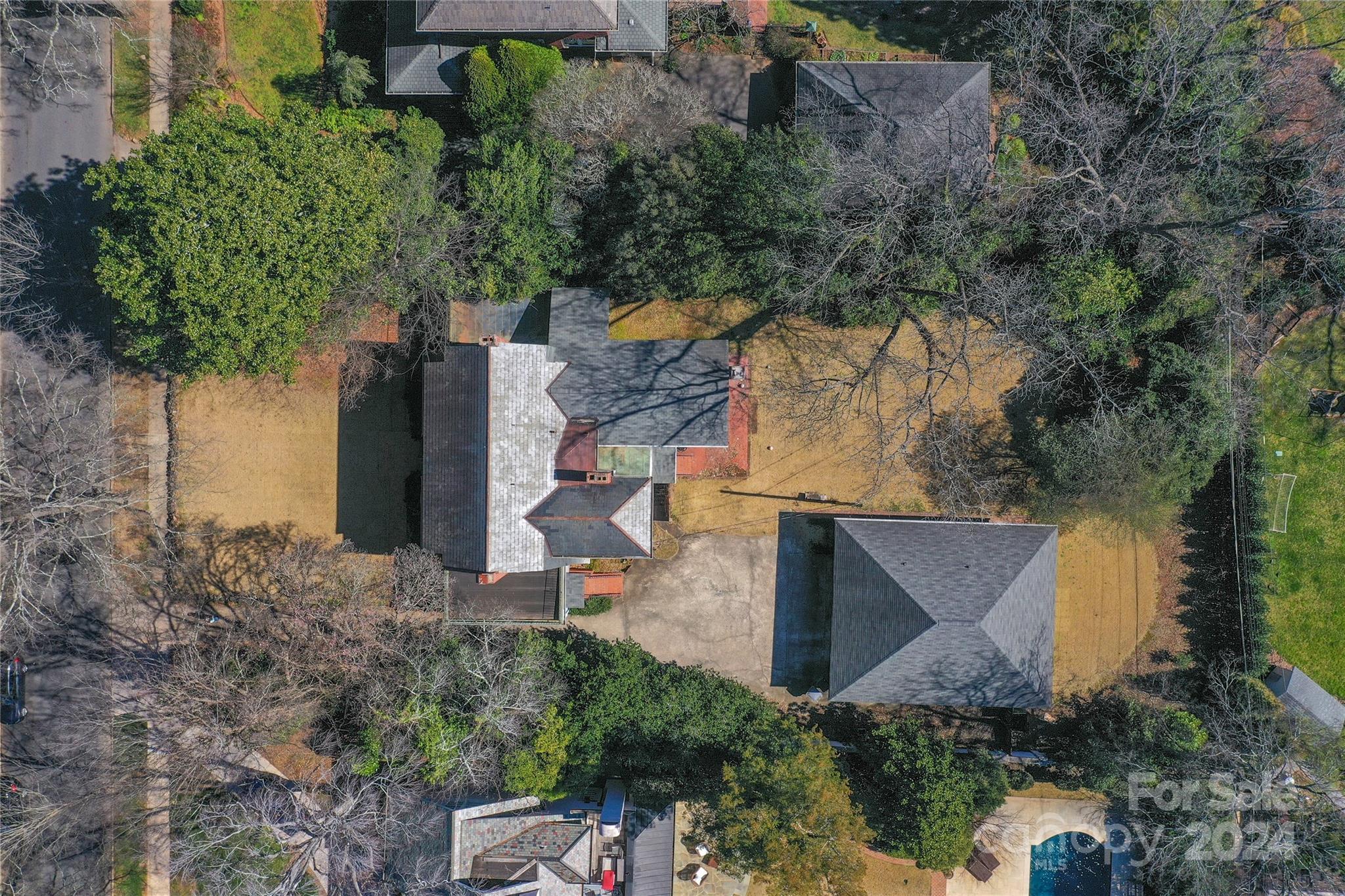 an aerial view of a house with outdoor space