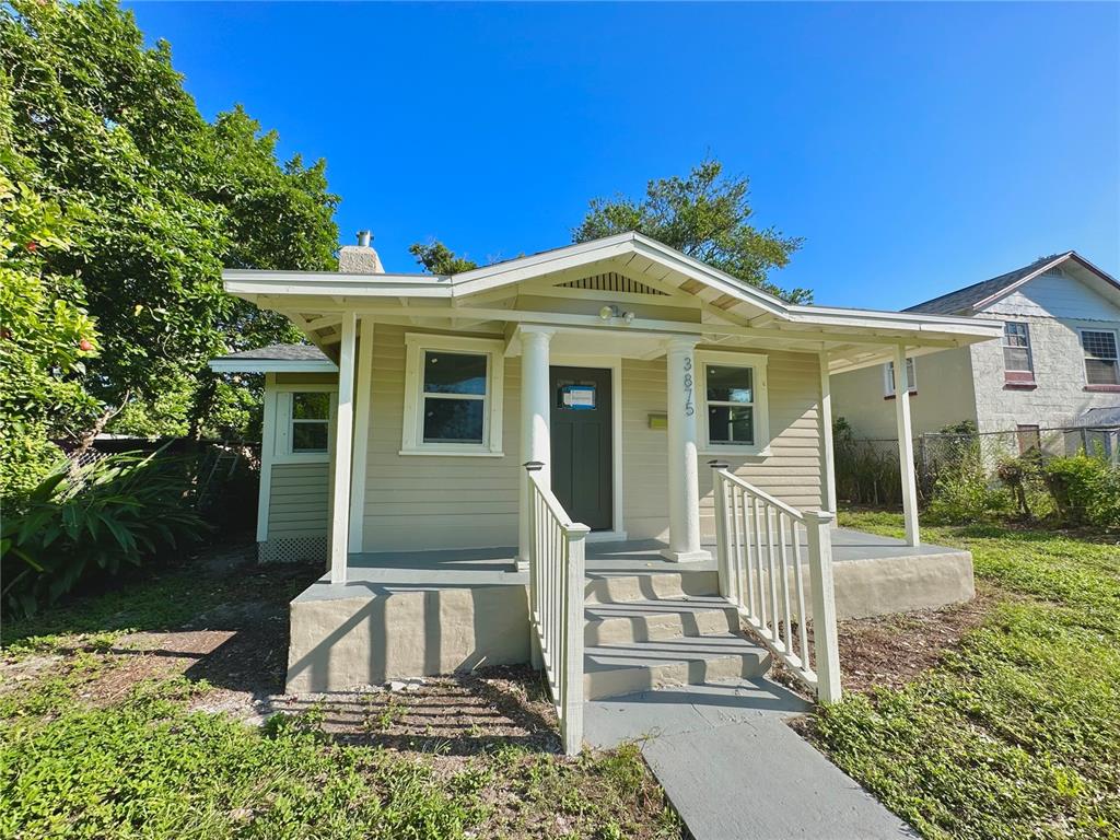 a front view of a house with a porch