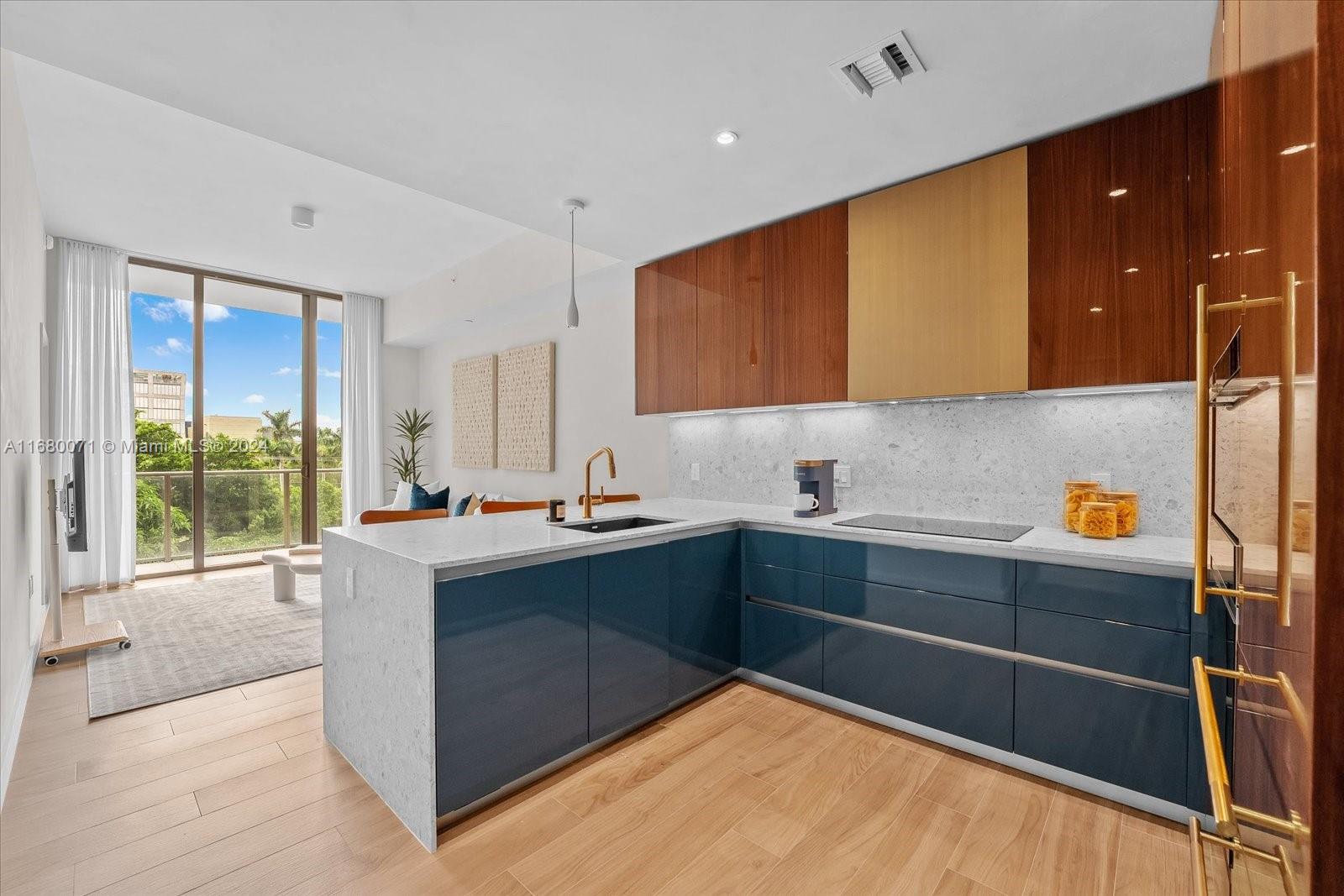 a kitchen with stainless steel appliances a sink stove and cabinets