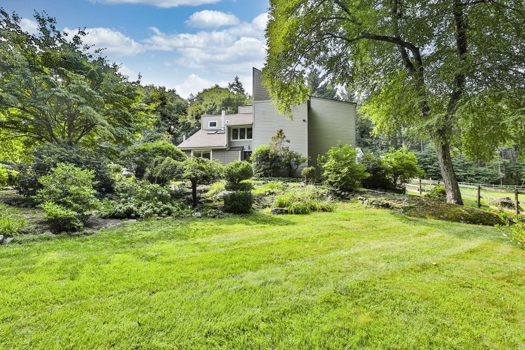 a view of a garden with a building in the background