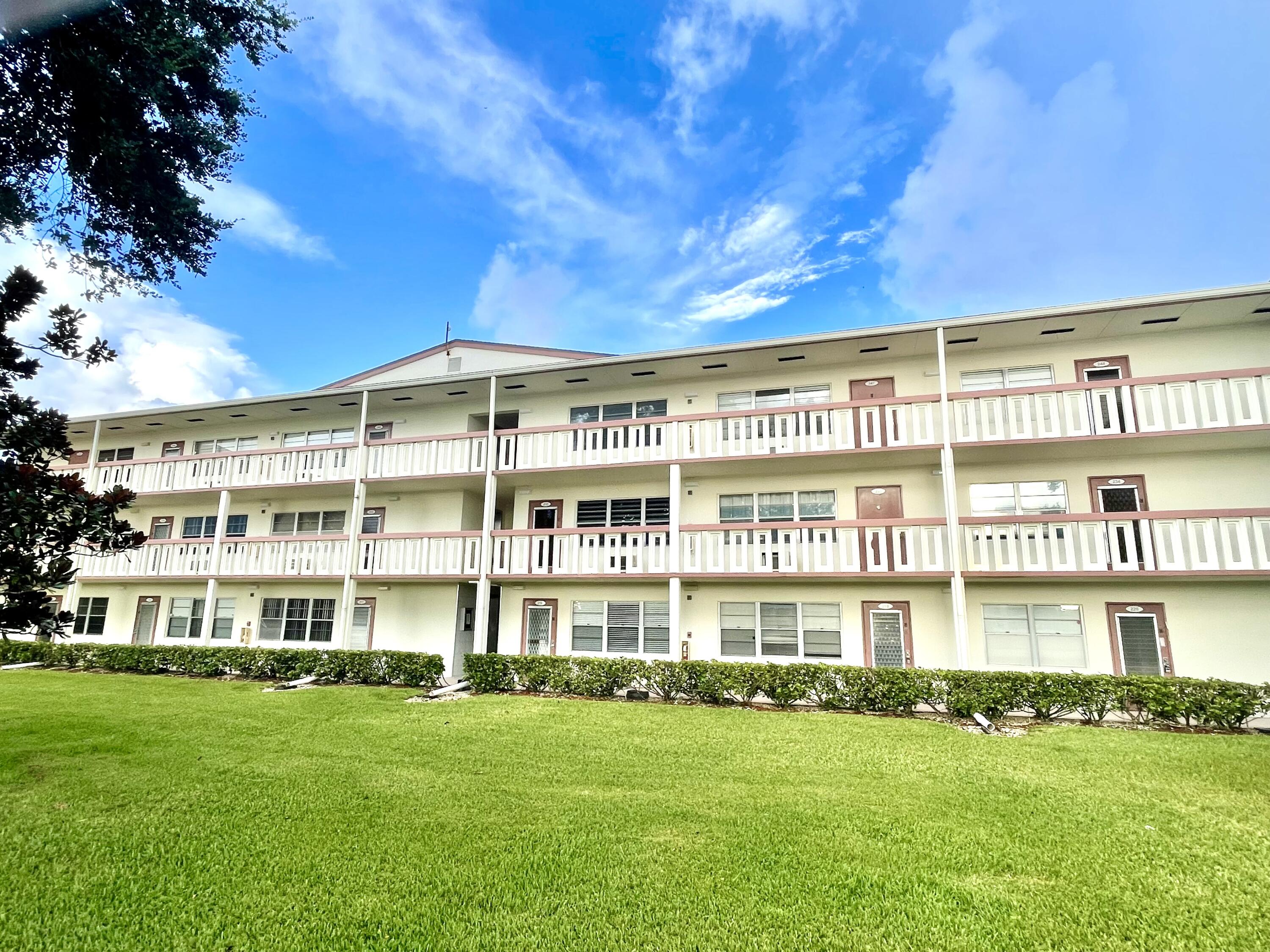 a view of an apartment with a garden