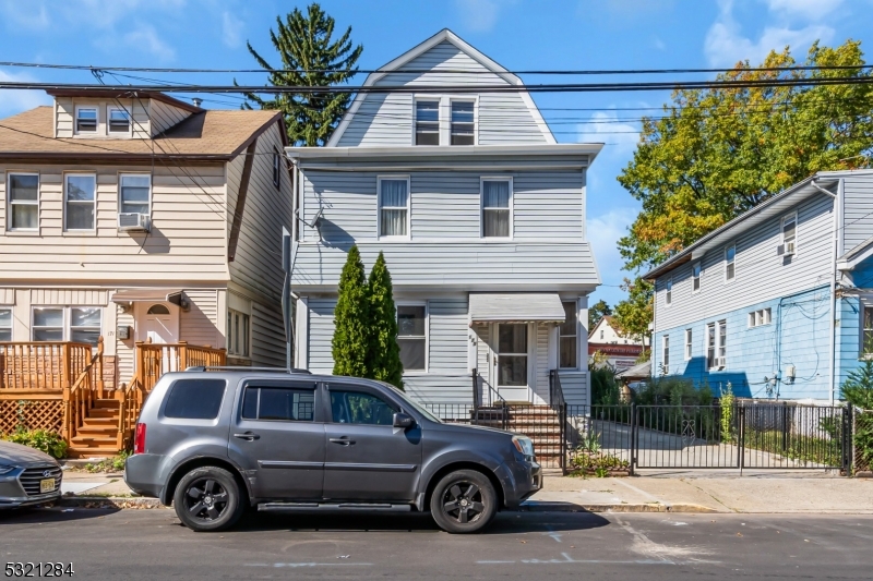 a car parked in front of a house