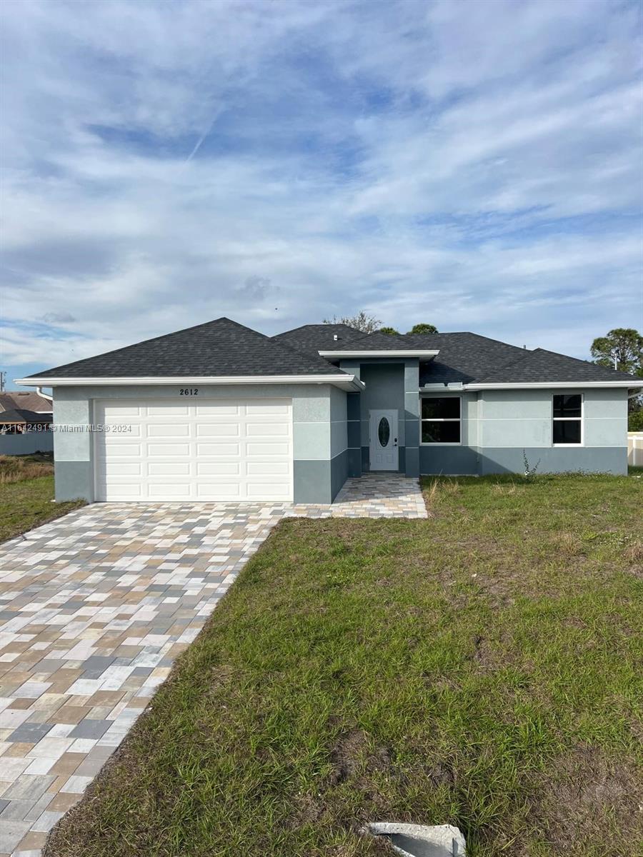 front view of a house with a yard