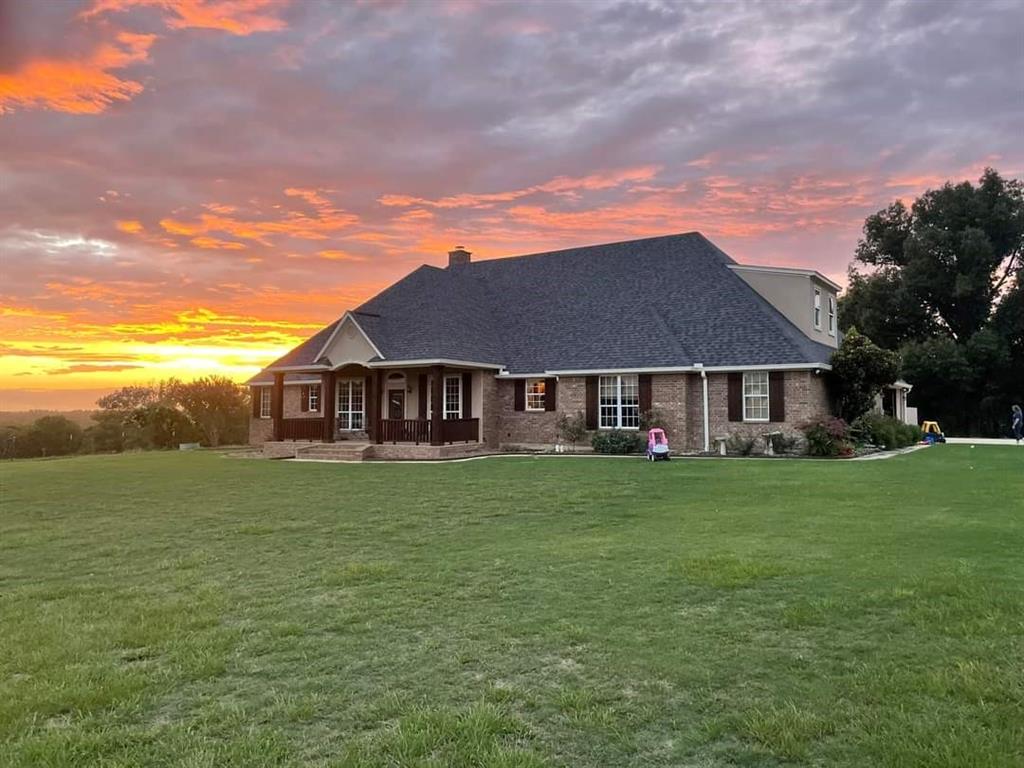 a view of a house with a big yard