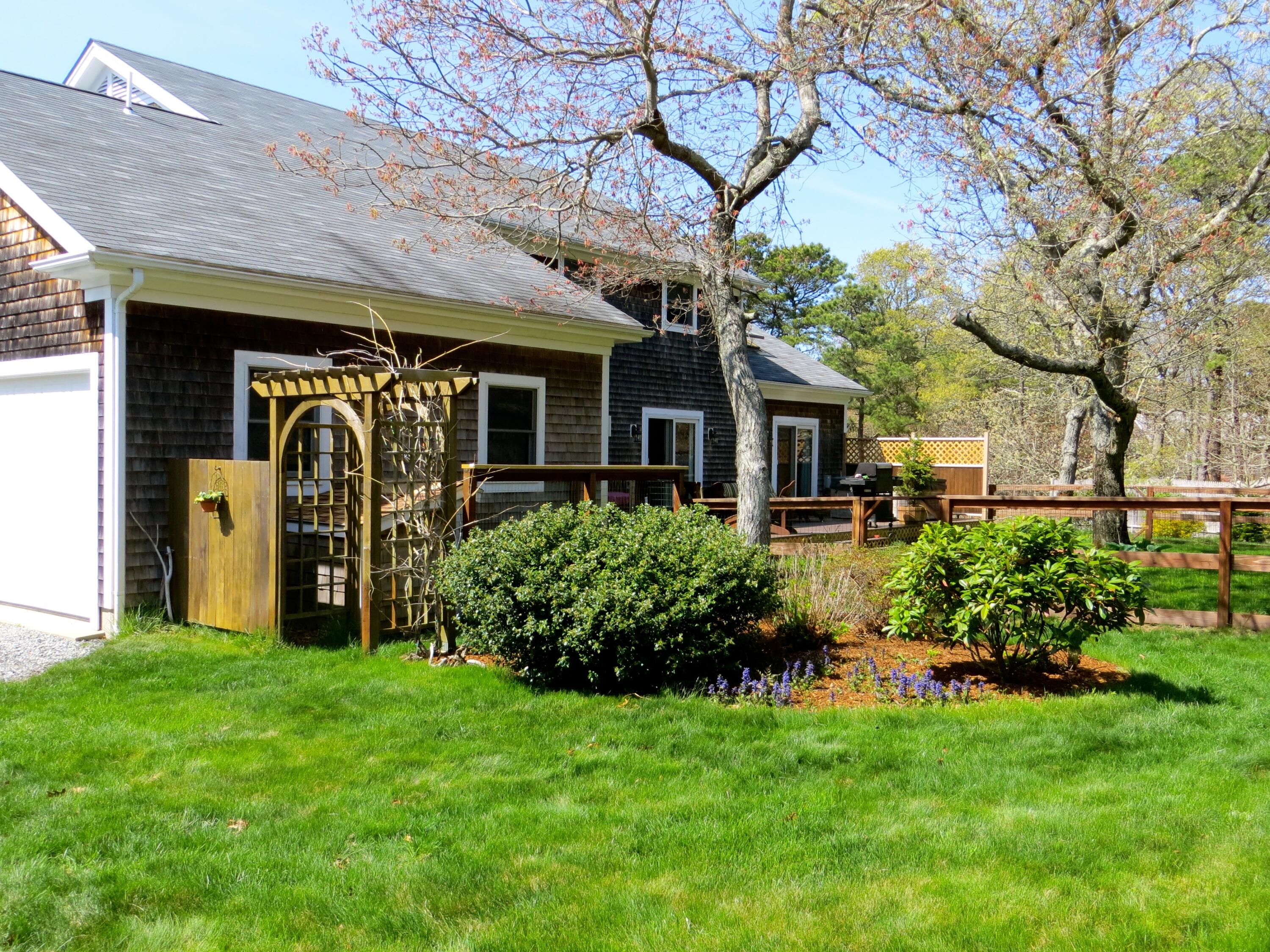 a front view of a house with garden