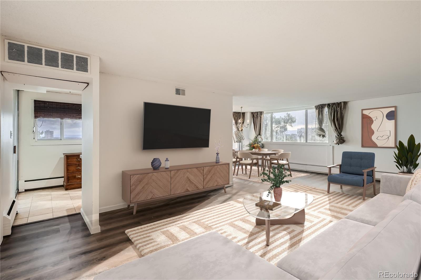 a living room with furniture and a flat screen tv