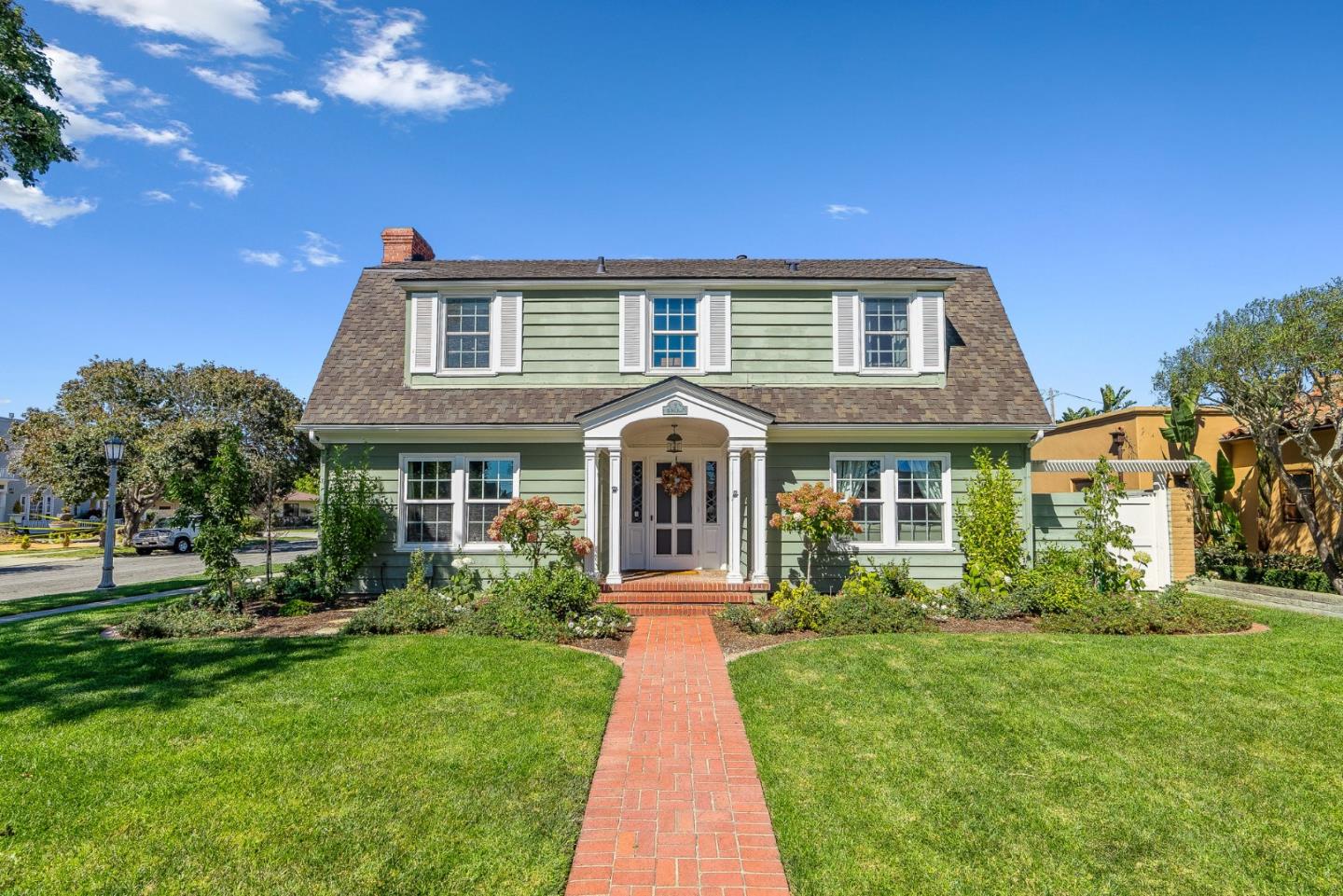 a front view of a house with garden