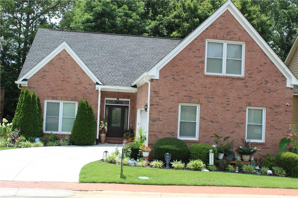 a view of a yard in front view of a house