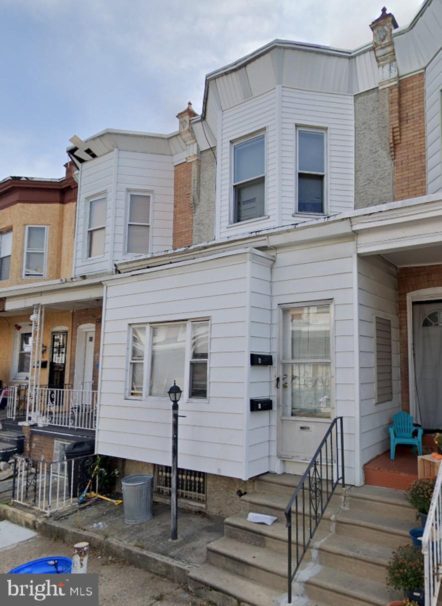 a front view of residential houses with stairs