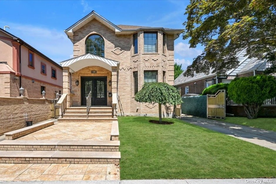 a front view of a house with a yard