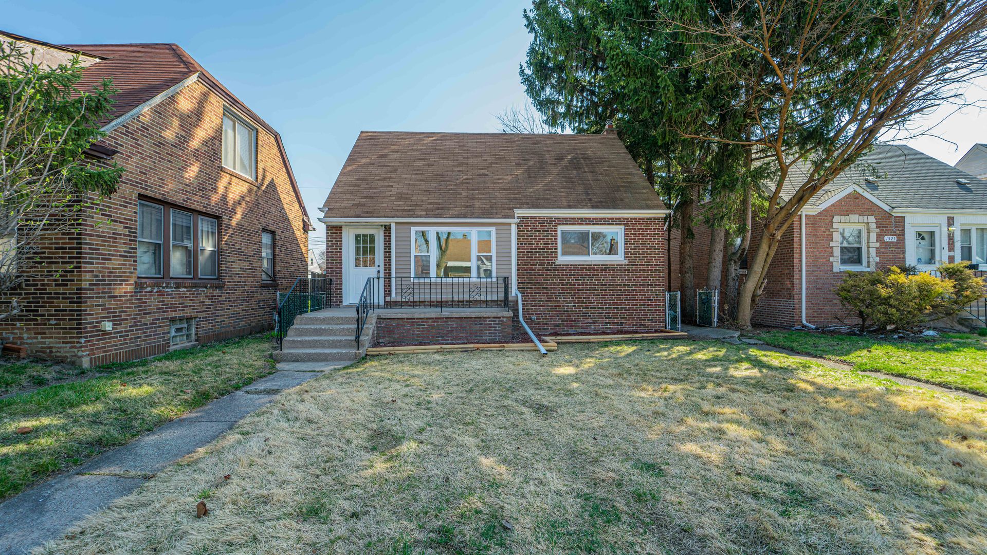 a house that has a tree in front of the house