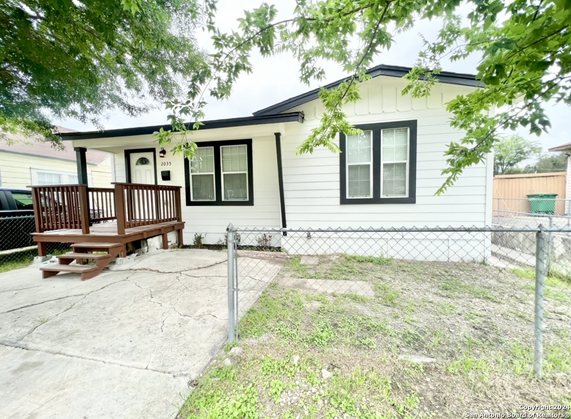 a front view of a house with a patio