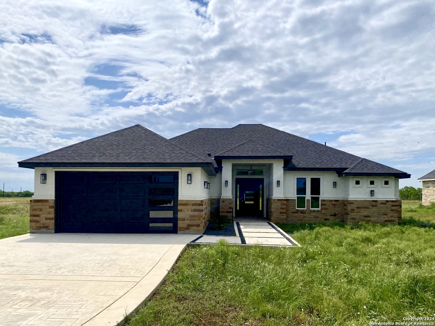 a front view of a house with yard