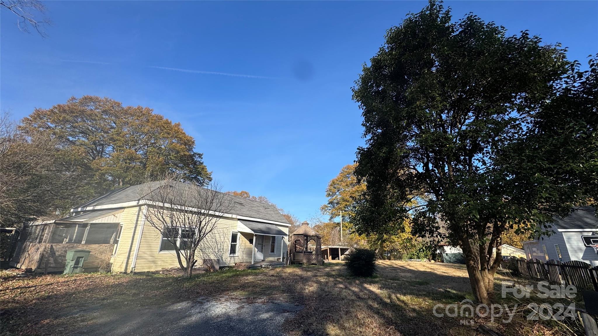 a view of a house with a tree